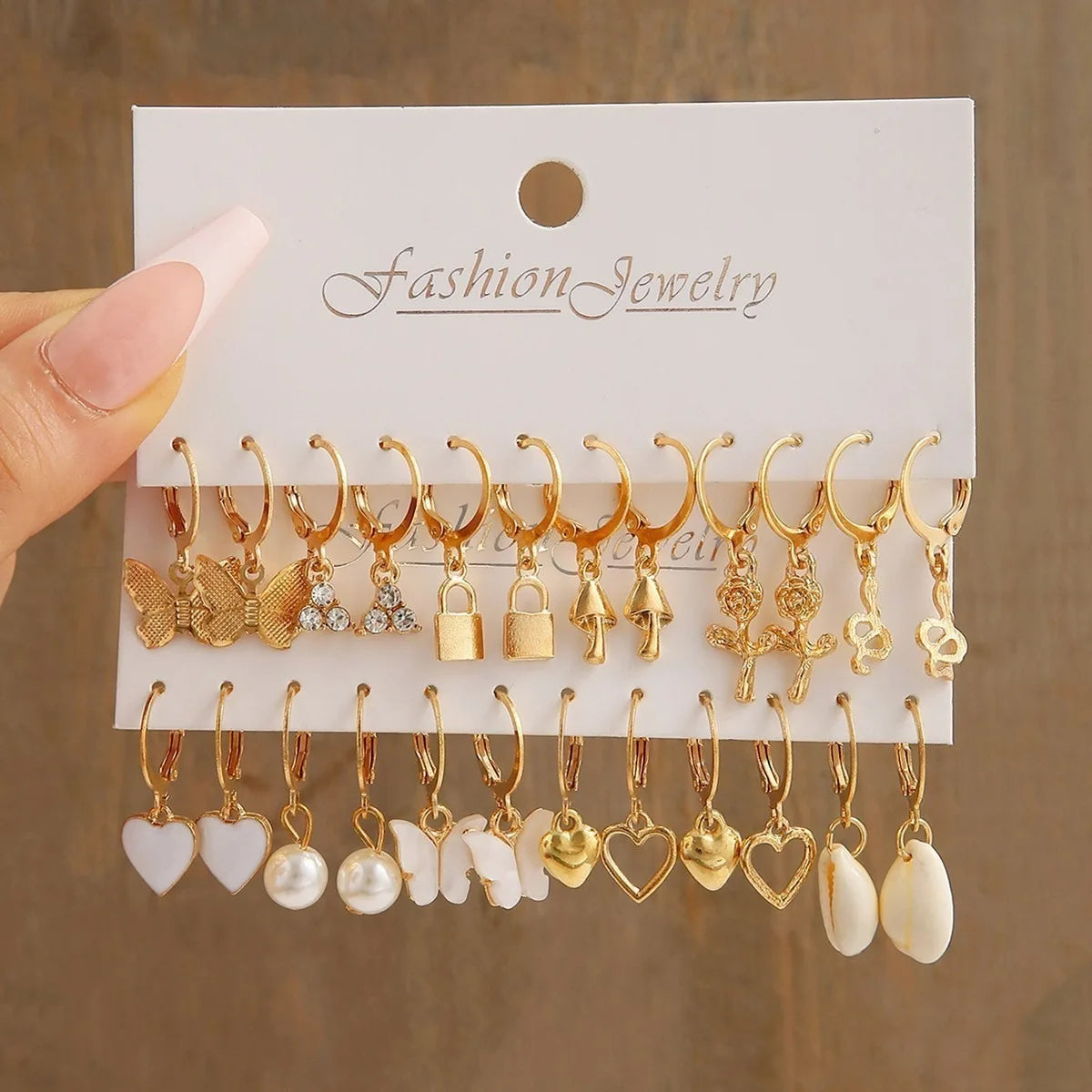 European and American metal earrings 24-piece set, fashionable and simple versatile alloy love pearl snake butterfly mushroom lo